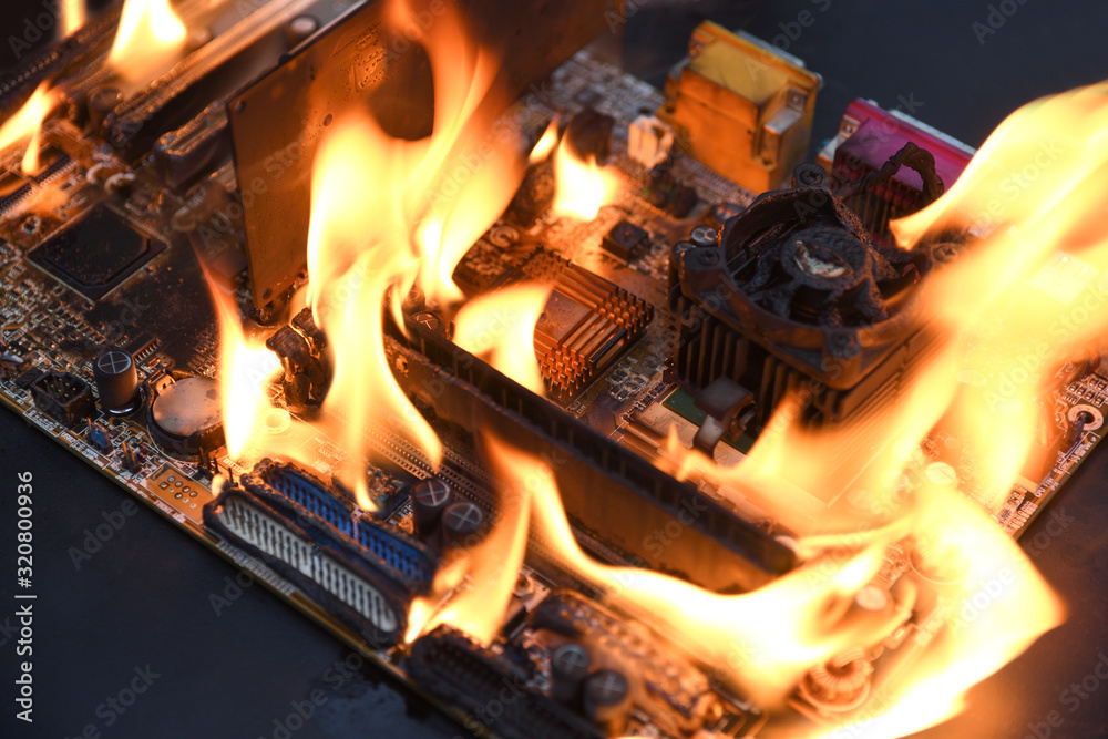 Fire Burning ,blazing computer motherboard, cpu,gpu and video card, processor on circuit board with electronic Fire Burning ,blazing computer motherboard, cpu,gpu and video card, processor on circuit board with electronic