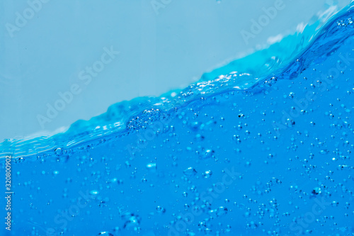 Water and air bubbles over white background with space for text.