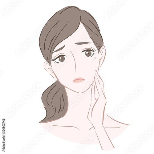 シミに悩む女性 