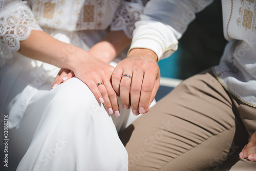 newlyweds demonstrating rings