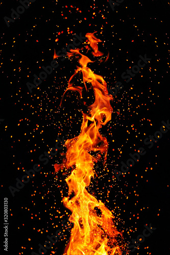 Flame, sparks on a black background