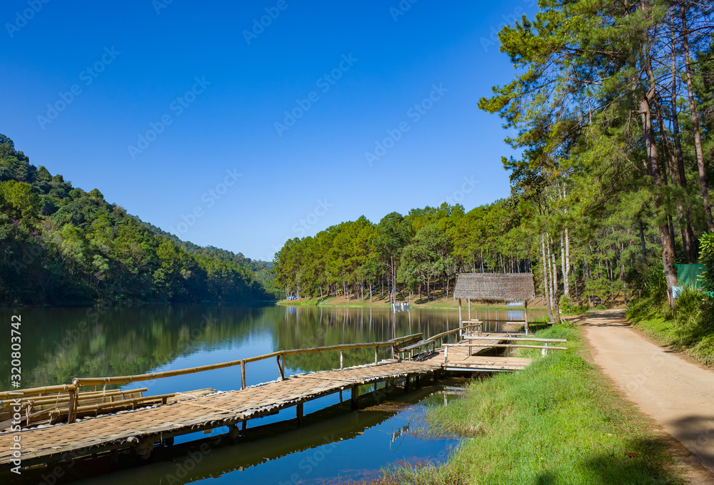 Fototapeta premium Pang Oung Roum Lake, Clear water wir reflection and trees, north of Thailand