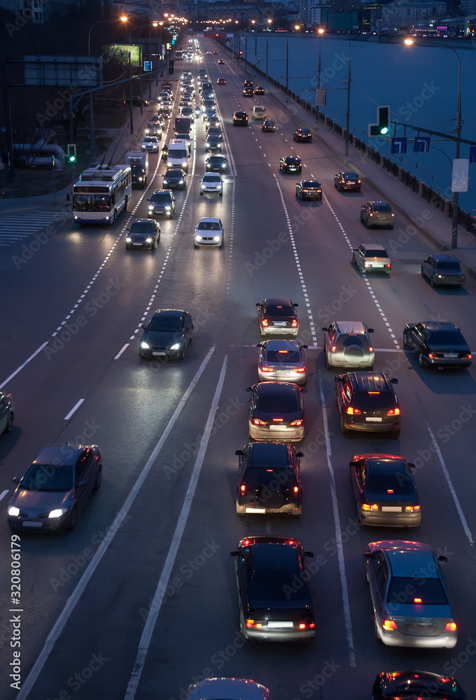 Car traffic on the avenue at night
