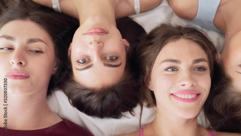 Attractive smiling ladies relaxing during hen party Attractive smiling ladies relaxing during hen party