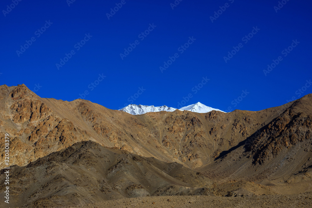 Snow mountain behide rock mountain in leh-Ladakh