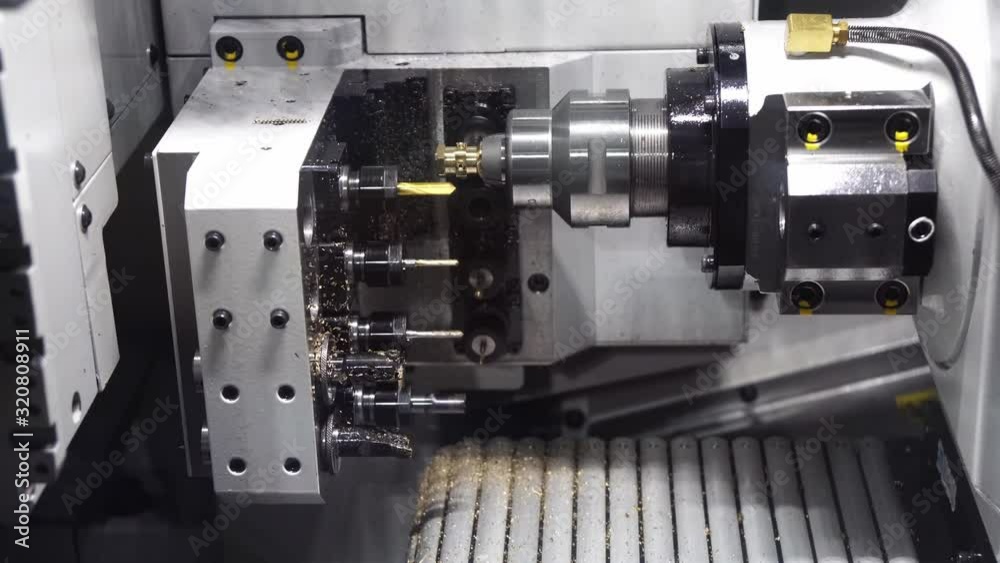 The swiss type CNC lathe machine making the brass connector parts for air-condition parts. The hi-technology metal working processing by multi-tasking CNC turning machine