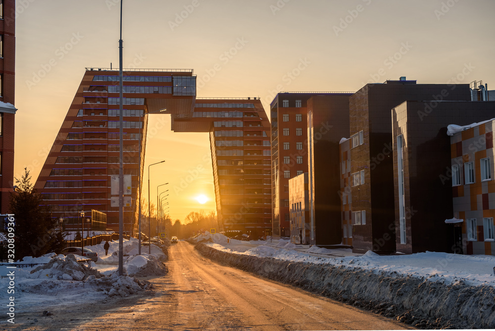 The building of the Technopark Akademgorodok during sunset, in winter.