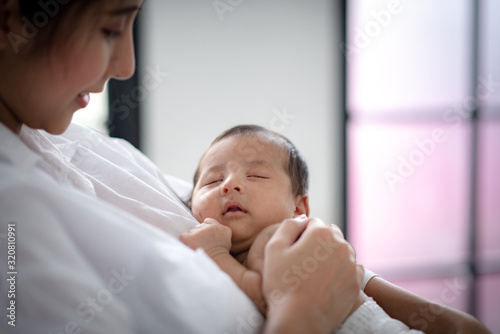 The baby is sleeping on a soft mattress