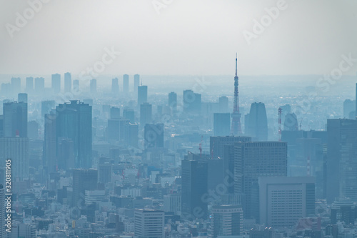 dust during daytime in a very polluted city - in this case Tokyo  Japan. Cityscape of buildings with bad weather from Fine Particulate Matter. Air pollution.