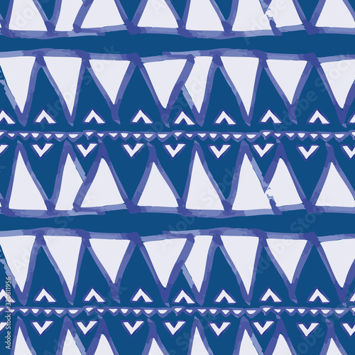 Vector seamless pattern ethnic indigo watercolor with white and blue triangles and blue background.