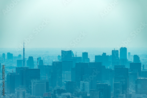 dust during daytime in a very polluted city - in this case Tokyo  Japan. Cityscape of buildings with bad weather from Fine Particulate Matter. Air pollution.