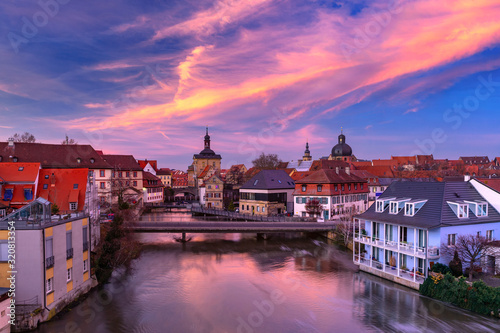 Aerial panoramic view of Old town hall or Altes Rathaus with bridges over the Regnitz river at sunset in Bamberg, Bavaria, Upper Franconia, Germany