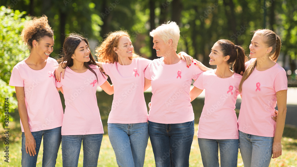 Women In Pink Ribbon T-Shirts Embracing Standing Outdoor, Panorama Women In Pink Ribbon T-Shirts Embracing Standing Outdoor, Panorama
