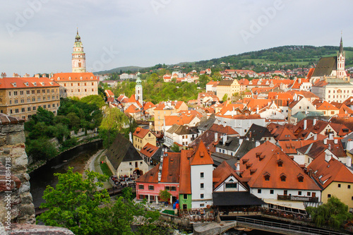 Aerial panoramic view of the typical colorful houses and landmarks of Cesky Krumlov with Vltava river at the foreground (Czech Republic)