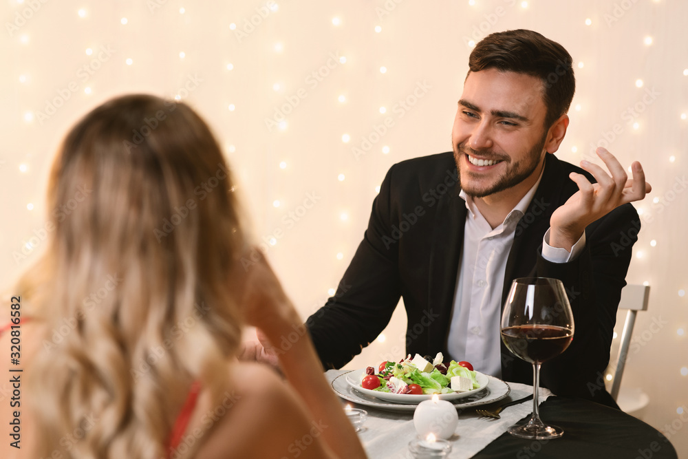 Couple In Love Enjoying Romantic Dinner In Restaurant Couple In Love Enjoying Romantic Dinner In Restaurant