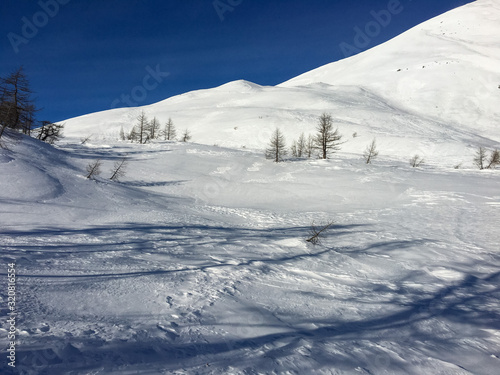 Panoramic view of the snowy Alpe Gattascosa in the high Bognanco valley in winter, Piedmont Italy.