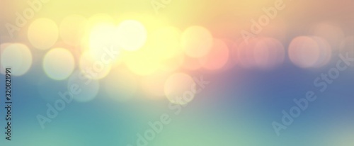 Golden bright bokeh blurred pattern. Blue yellow gradient background. Festive banner defocus illustration. Bright lights abstract texture. 