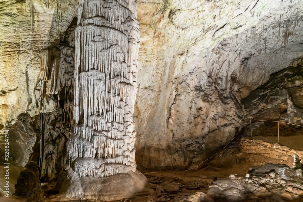 POSTOJNA, SLOVENIJA - JANUARY 28, 2020: Postojna cave -one of the biggest tourist attractions in Slovenia. 24 km long  cave system with stalactites and stalagmites.