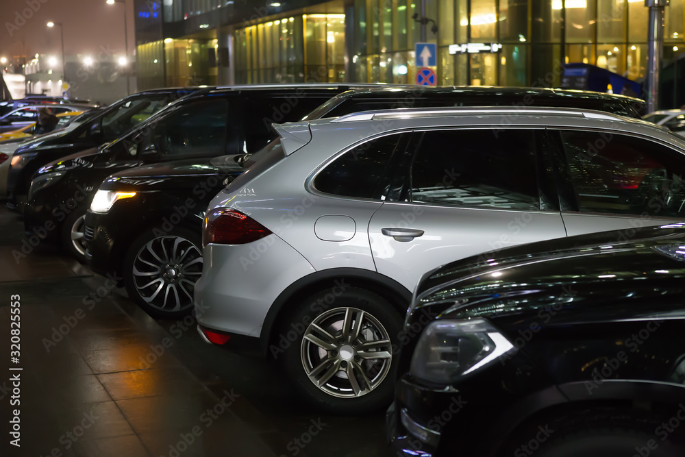 Cars in the parking lot on at night