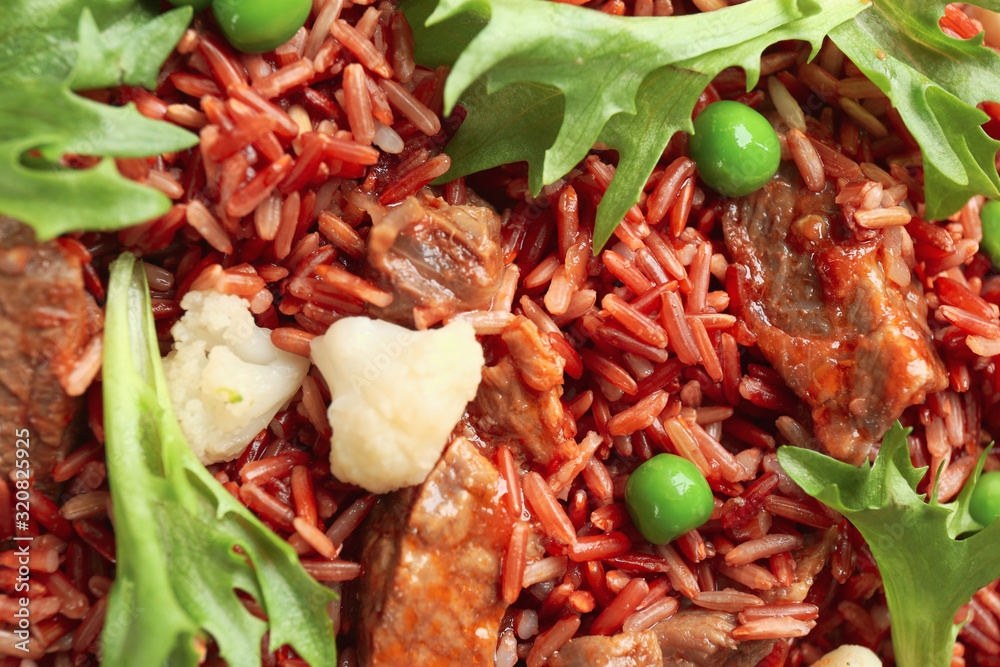 Tasty brown rice with meat and vegetables as background, top view Tasty brown rice with meat and vegetables as background, top view