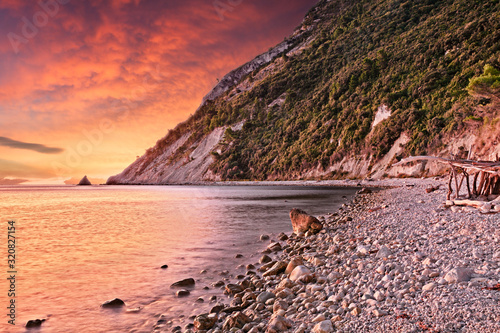 Fototapeta Naklejka Na Ścianę i Meble -  Portonovo, Ancona, Marche, Italy: landscape at dawn of the beach on the Adriatic sea coast in the Conero regional park