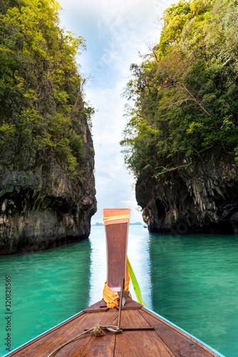 A boat sailing in the blue water of Hong Island (Lagoon, Hong Island, Krabi), Krabi, Thailand