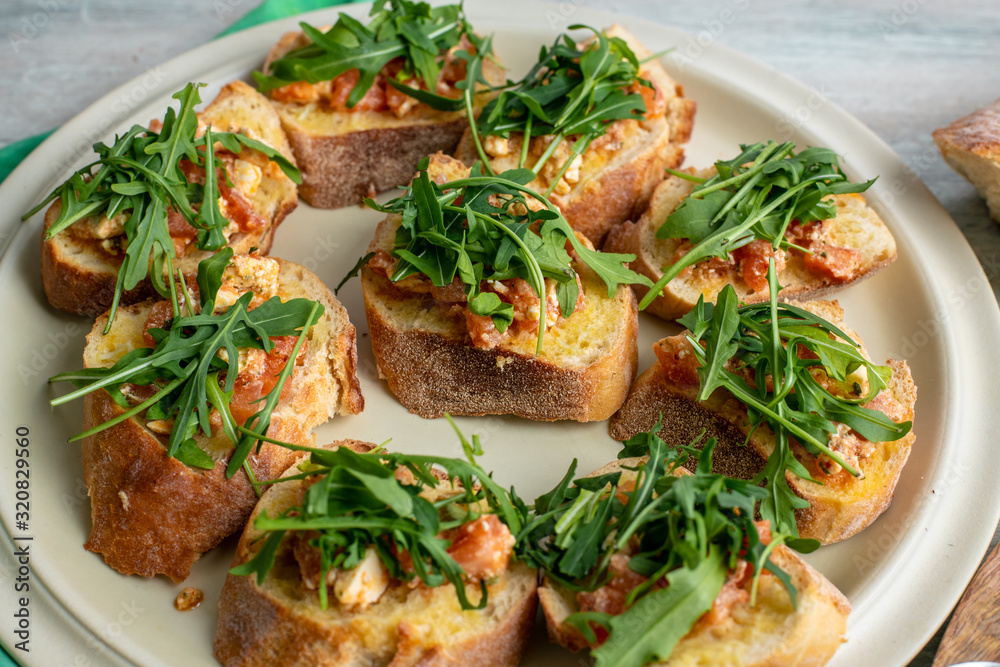 bruscetta with tomatoes, mozzarella and arugula bruscetta with tomatoes, mozzarella and arugula