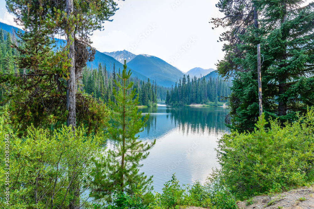 Majestic mountain lake in Canada. Lightning Lake in Manning Park in British Columbia. Lake Trail View. Majestic mountain lake in Canada. Lightning Lake in Manning Park in British Columbia. Lake Trail View.
