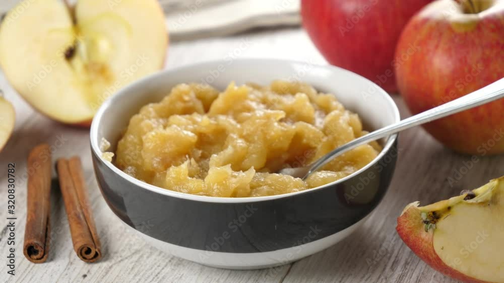 bowl of apple sauce and cinnamon bowl of apple sauce and cinnamon