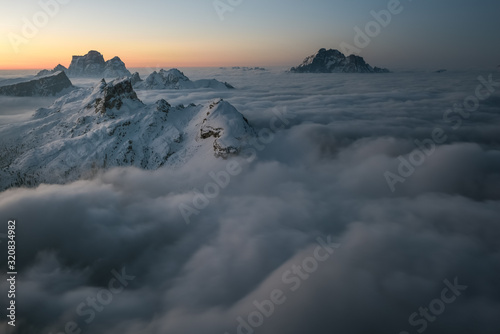 Sunrise from the top of the mountain Lagazuoi towards the Dolomites of Cortina and Zoldana valley. photo