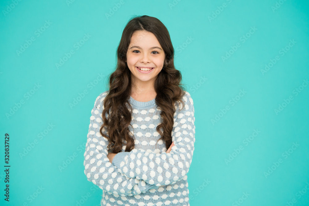 Salon that gives you confidence. Happy girl wear wavy hairstyle. Little child with long brunette hair. Hair salon for kids. Beauty salon. At hairdressers. Create new look in salon, copy space Salon that gives you confidence. Happy girl wear wavy hairstyle. Little child with long brunette hair. Hair salon for kids. Beauty salon. At hairdressers. Create new look in salon, copy space