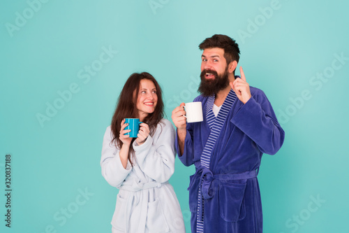 Morning inspiration. happy family day. man and woman drink cup of tea. Spending great time at home. couple in love enjoy morning. wear cosy robe. Tastes delicious. Breakfast time. relax with coffee