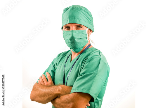 hospital clinic staff corporate portrait of attractive and successful medicine doctor smiling confident in green medical clothes and protective face mask and bouffant cap