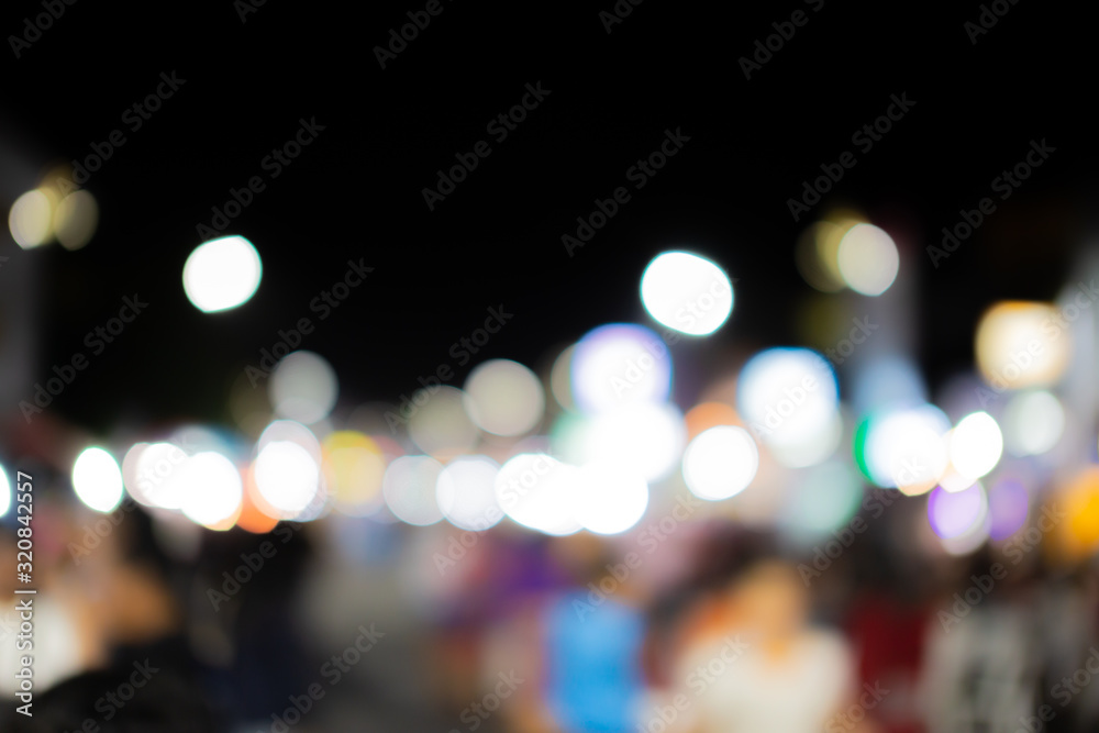 Blurred image of people in day market festival in city park background