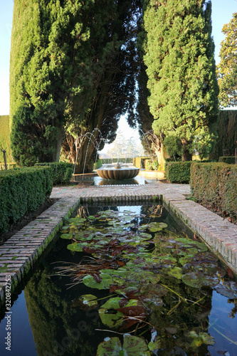 Beautful fountain in the Alhambra Heneralife moorish garden, Granada, Spain