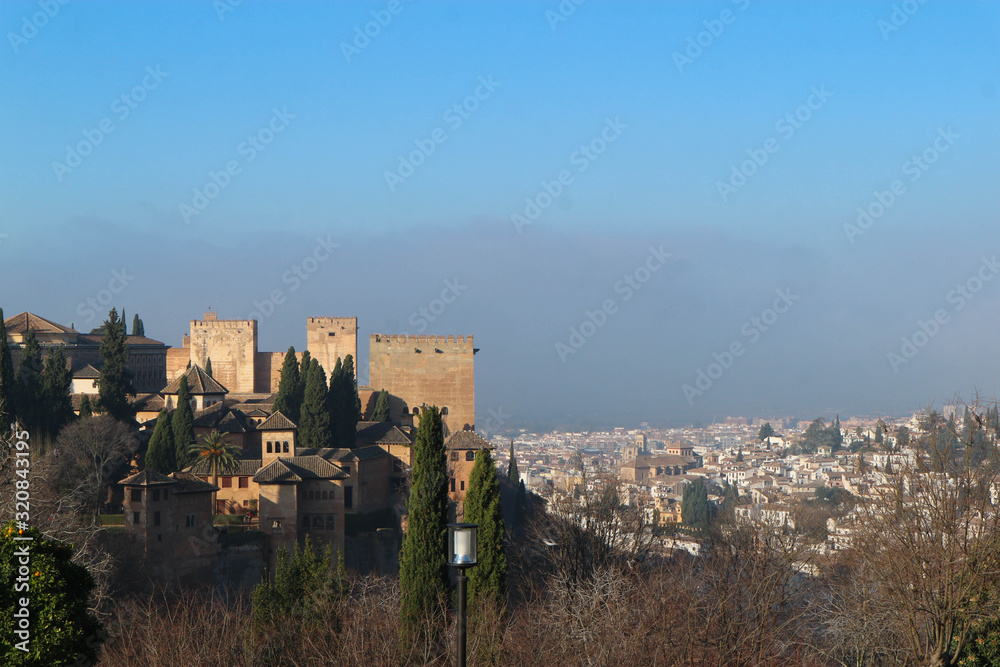Panoramic view to Alhambra citadel and Granada city in winter morning