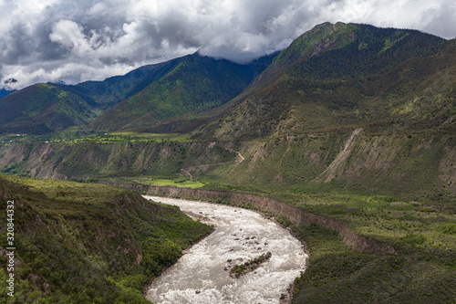 Panorama view of Yarlung Tsangpo (Yarlung Zangbo) Grand Canyon , Brahmaputra Canyon or Tsangpo Gorge and Yarlung Tsangpo River in summer wit blue sky cloud, Tibet, China