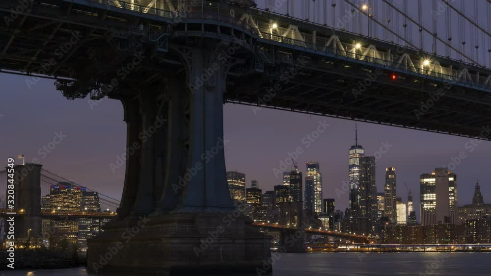 Financial District and Manhattan bridge from East river night to day time lapse