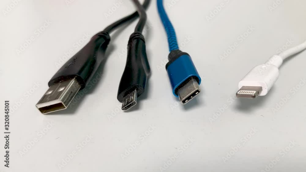 USB cable against white background USB-A USB-C Micro USB and Lightning Cable to connect