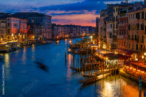 Grand Canal with gondolas in Venice  Italy. Sunset view of Venice Grand Canal. Architecture and landmarks of Venice. Venice postcard
