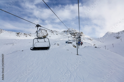 Whistler Ski Resort, British Columbia, Canada. Beautiful View of the snowy Canadian Nature Landscape Mountain and Chairlift going to the peak during a vibrant winter morning.