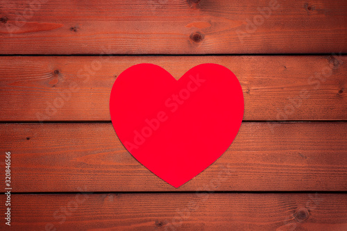 Valentines day background with Big red heart on a wooden background. Copyspace. Suitable for congratulations, greeting cards, decoration, declaration of love