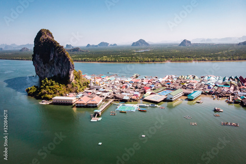 Beautiful landscape mosque sea and sky in summer at Punyi island, Ko Panyi or Koh Panyee, Muslim fisherman village landmark attractions travel by boat at Ao Phang Nga Bay National Park, Thailand, Asia photo