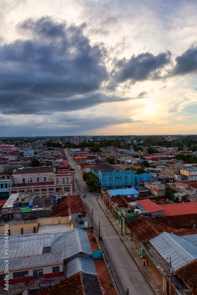 Ciego de Avila, Cuba - June 14, 2019: Aerial view of a small Cuban Town during a cloudy and colorful sunset.