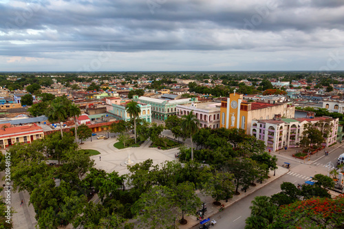Ciego de Avila, Cuba - June 14, 2019: Aerial Panoramic view of a small Cuban Town during a cloudy and colorful sunset.