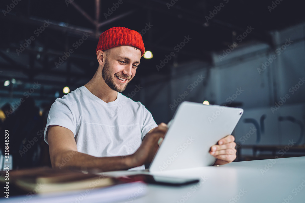 Handsome young man working with tablet Handsome young man working with tablet