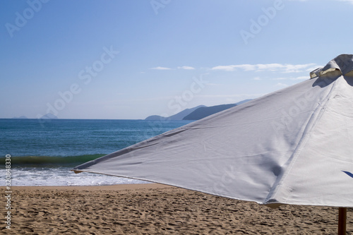 beach umbrella against the blue sea