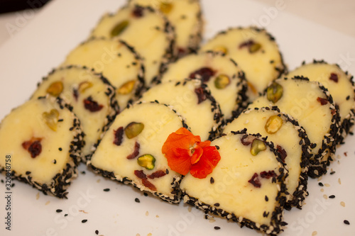 cream cheese with pistachios and red flower