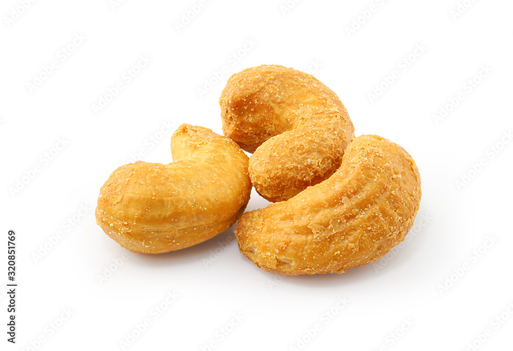 Close up salted cashew nuts isolated on white background with clipping path. Close up salted cashew nuts isolated on white background with clipping path.
