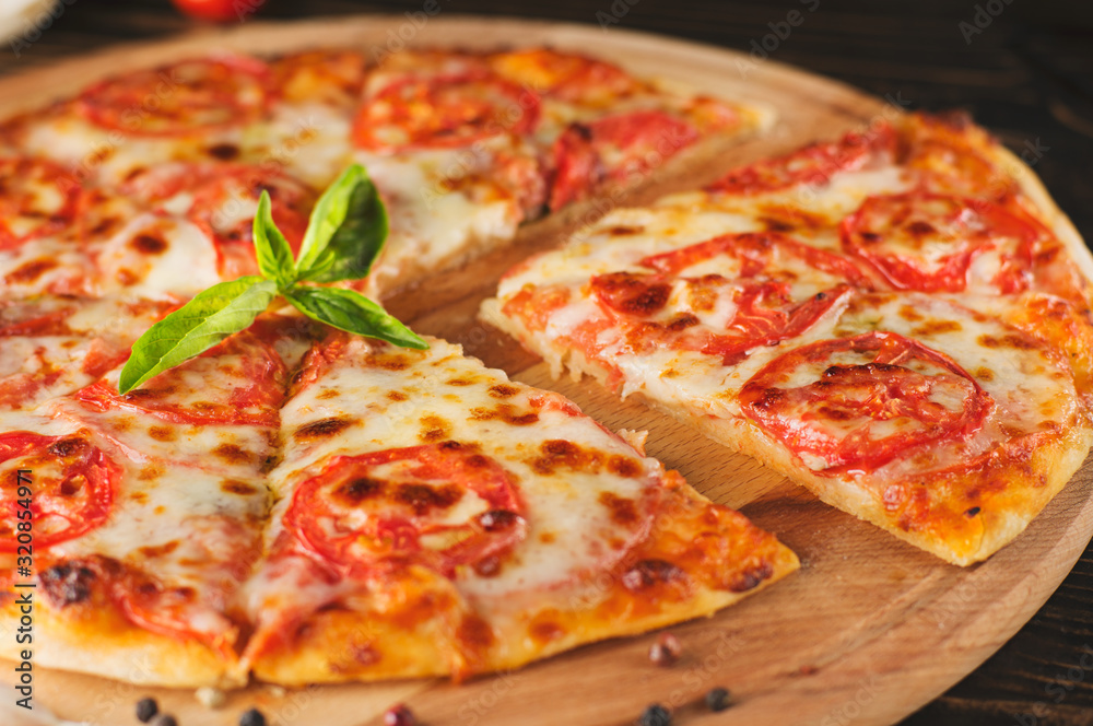 pizza with cherry tomatoes and black olives